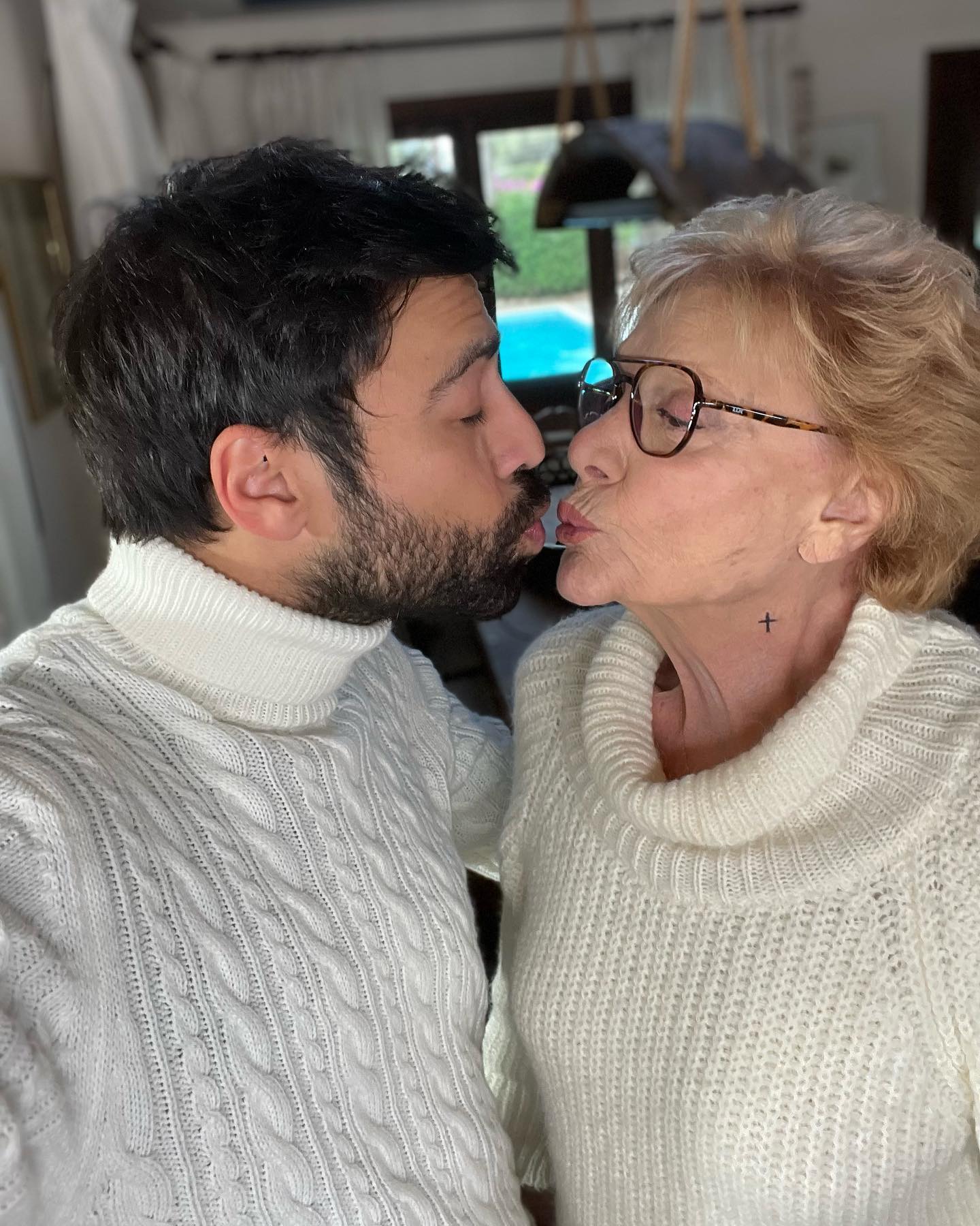 Photo shared by Andreas Geo on June 21 2023 tagging @maro kontou. May be a selfie of 2 people people kissing sweater turtleneck and knit