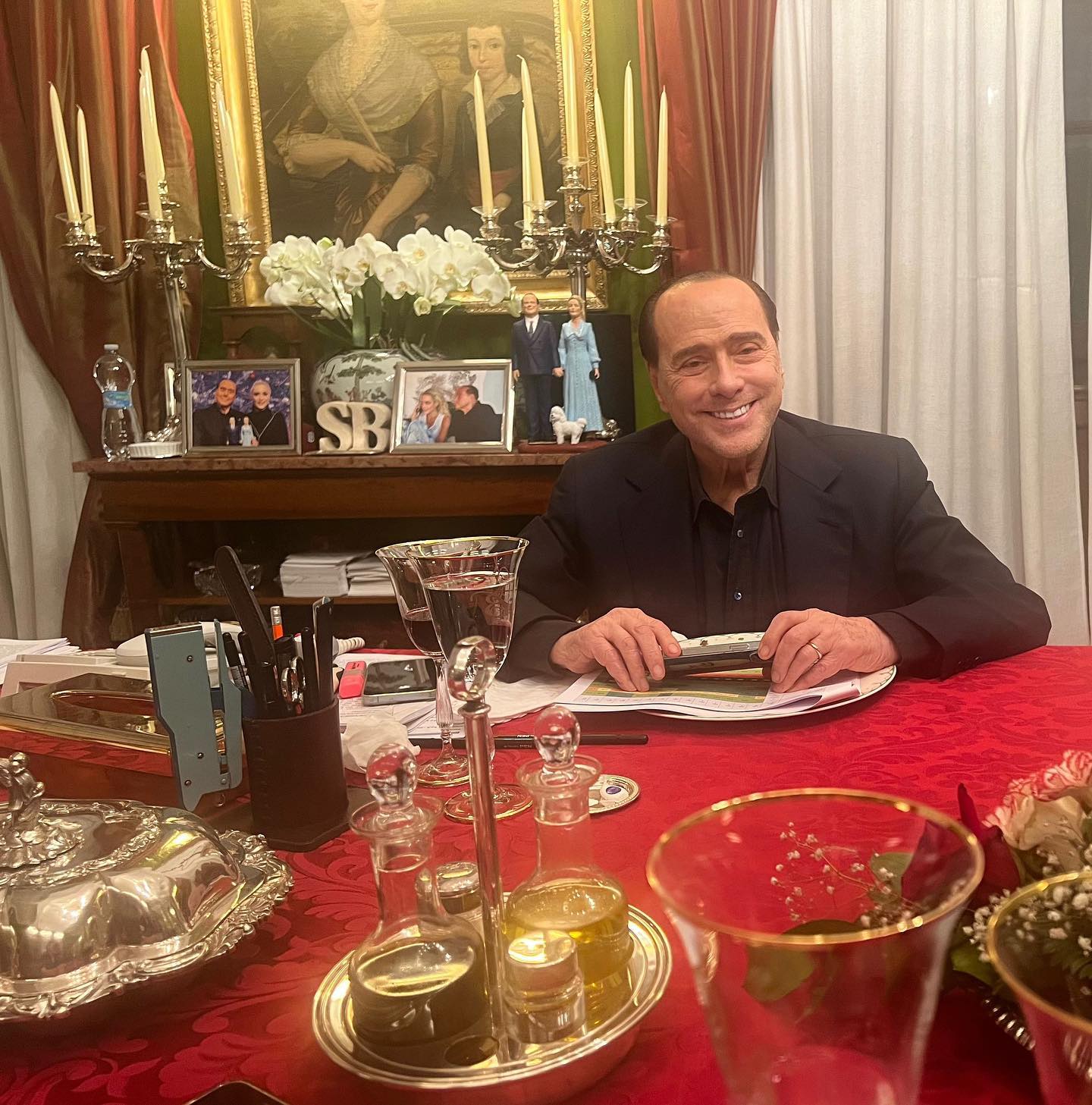 Photo by Silvio Berlusconi on March 31 2023. May be an image of candle holder and tablecloth